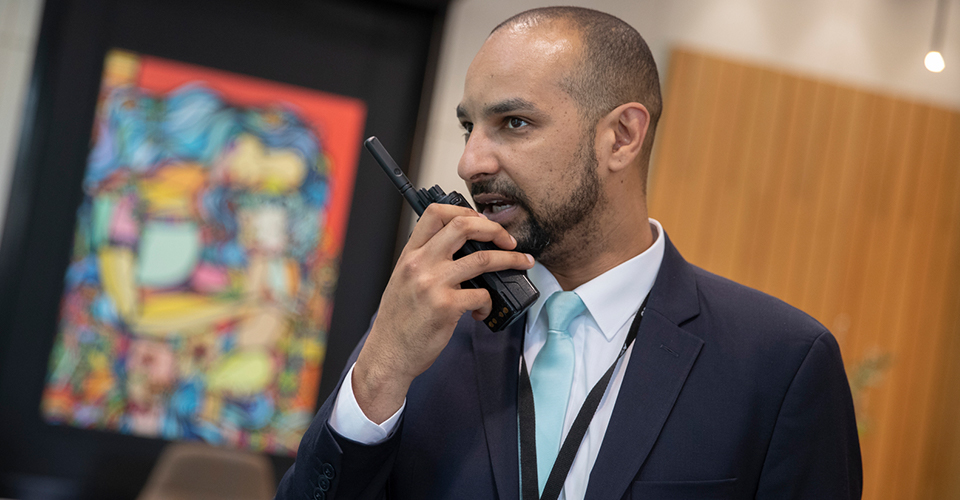 security professional talking on radio